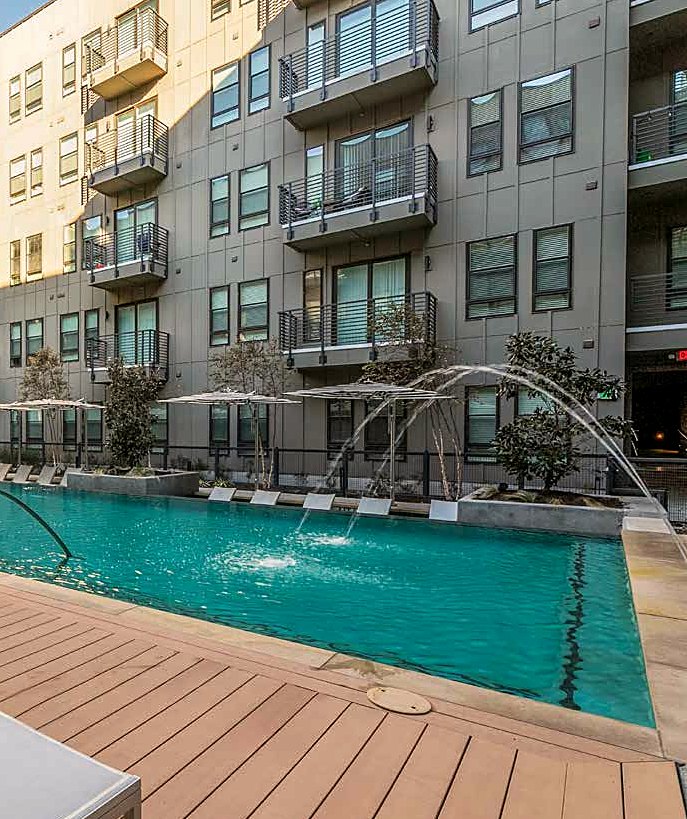 Daytime pool at The Cooper with fountain jets